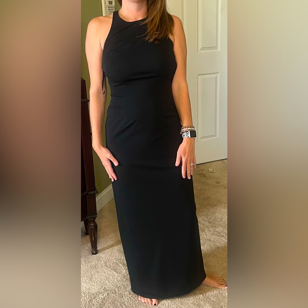 Beautiful full length black dress with low cut crossed back